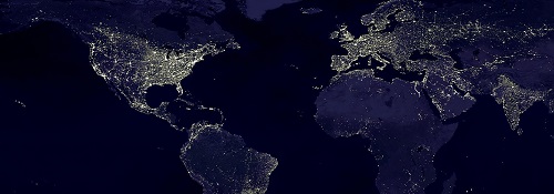 The globe at night with lights visible across the world